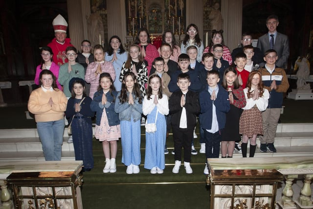 Pupils from Long Tower PS who received the Sacrament of Confirmation from Rev. Dr. Donal McKeown at St. Columba’s Church, Long Tower on Thursday evening last. Included is Mr. Ian Gallagher, Vice Principal. (Photos: Jim McCafferty Photography)