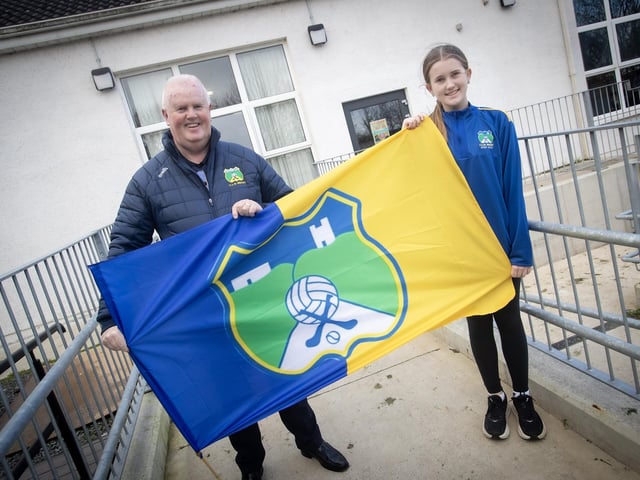 Liam Gallagher, club chair and his granddaughter who is a pupil at  St. Aengus'' National School, Bridgend showing their support for the Beart GAC hurlers who will take on Lavey in the Ulster Junior Championship final at Celtic Park on Saturday. (Photos: Jim McCafferty Photography)