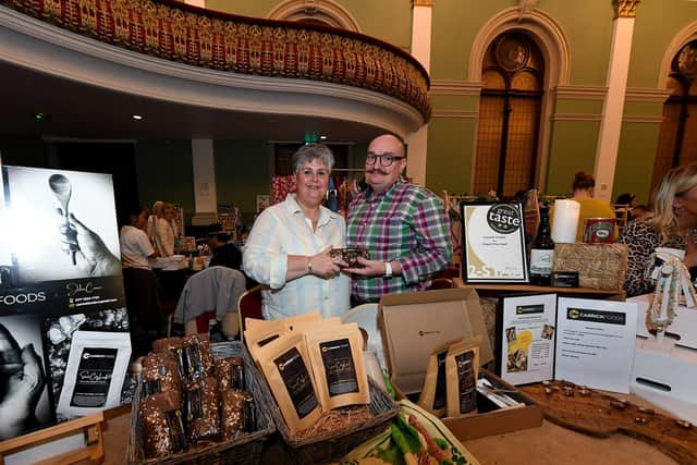 Andrena and Jonathan alongside their Carrick food and Stout Loaf stall at the Flower Moon market held at Columb’s Hall on Saturday afternoon.  Photo: George Sweeney.