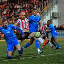 Derry City‘s Liam Boyce gets a shot on target against Waterford. Photo: George Sweeney