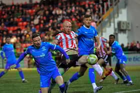 Derry City‘s Liam Boyce gets a shot on target against Waterford. Photo: George Sweeney