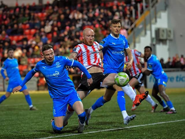 Derry City‘s Liam Boyce gets a shot on target against Waterford. Photo: George Sweeney