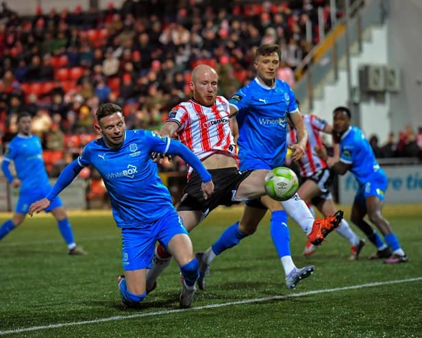 Derry City‘s Liam Boyce gets a shot on target against Waterford. Photo: George Sweeney