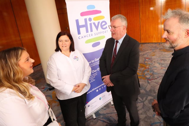 Maureen Collins, Project Manager and Grace Burke Programmes and Services Worker at Hive Cancer Support pictured with NI Health Minister Mike Nesbitt at the the World Cancer day Conference in Derry.