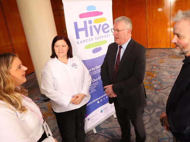 Maureen Collins, Project Manager and Grace Burke Programmes and Services Worker at Hive Cancer Support pictured with NI Health Minister Mike Nesbitt at the the World Cancer day Conference in Derry.