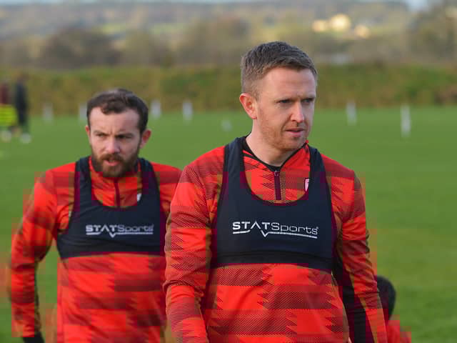 Derry City full back Shane Ferguson with Paul McMullan in training.  Photograph: George Sweeney
