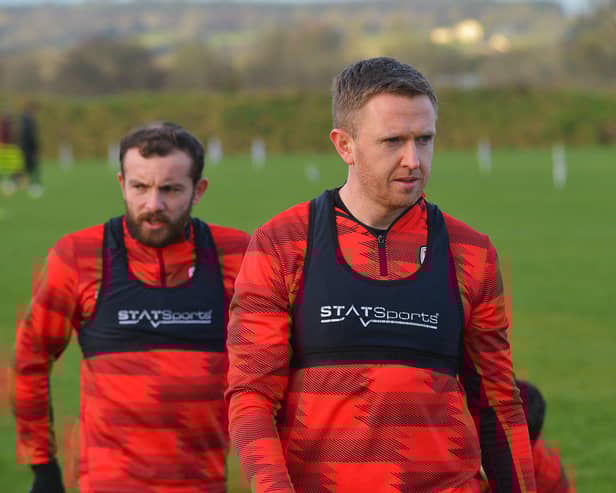 Derry City full back Shane Ferguson with Paul McMullan in training.  Photograph: George Sweeney