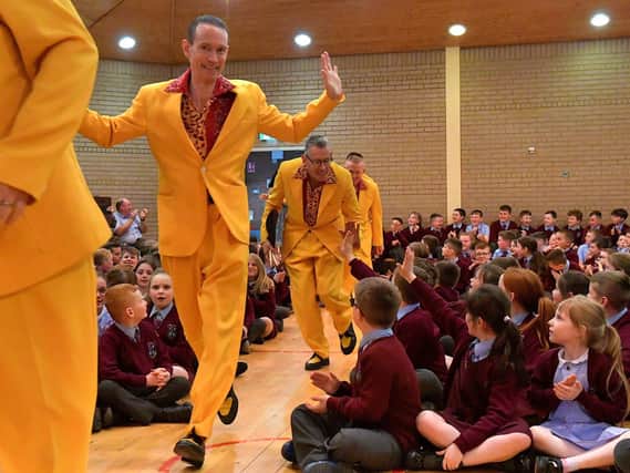 Jive Aces arrive at St John’s Primary School on Thursday afternoon. Photo: George Sweeney. DER2317GS – 19