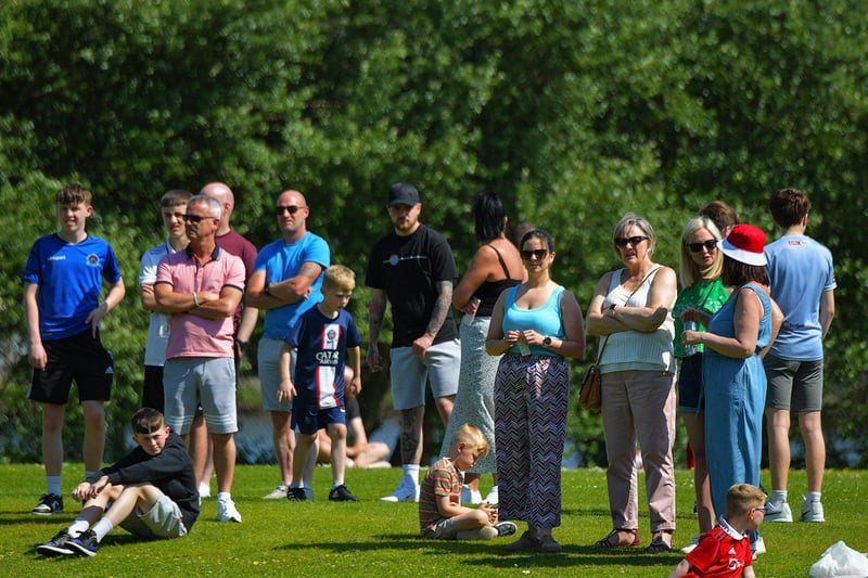 Spectators enjoy the sunshine and soccer at the D&D Championship Summer Cup finals at Prehen on Sunday morning last. Photo: George Sweeney. DER2322GS - 50