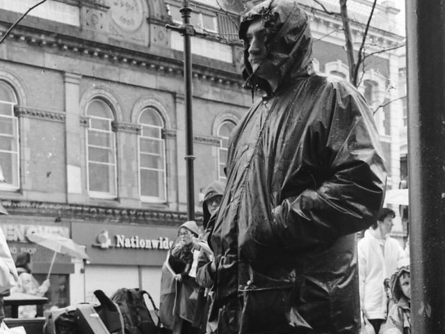 An attendee at a low wage protest at the Guildhall.