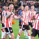 Danny Mullen pumps his fist at the travelling Derry City support at Dalymount Park after his match winning stoppage time strike. Photograph by Kevin Moore.