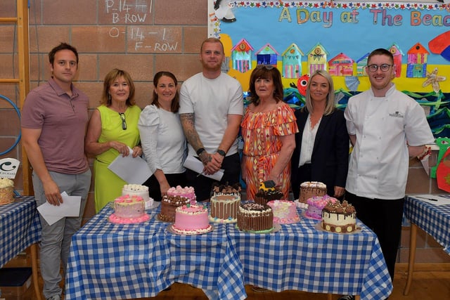 Mark Froydenlund, The Exchange, Augusts Nett, Patricia’s Café, Shauna Froydenlund, The Exchange, Mark Connolly, Derry City FC, Patricia Mahon, Patricia’s Café, and Marie Leighton and Caolan Chrystal, from Bishop’s Gate Hotel, were the judges at the Derry School Bake Off held in Ardnashee College and School on Friday morning. Photo: George Sweeney. DER2324GS – 81