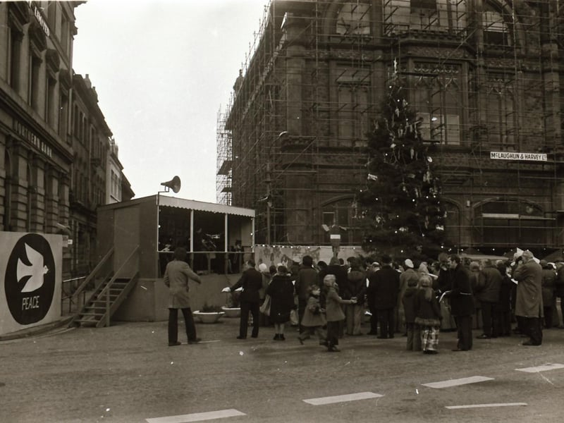 Interdenominational Christmas carols for peace outside the Guildhall in December 1974.