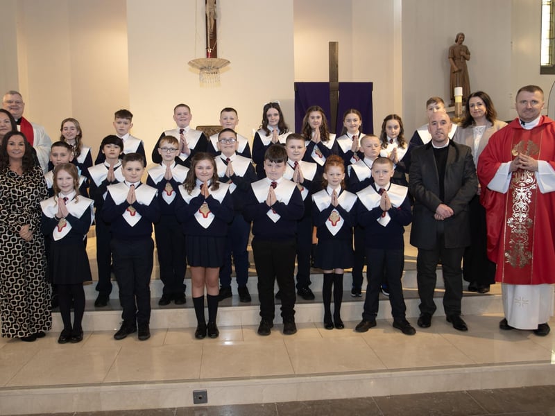 Pupils from Holy Child Primary School, Creggan, Derry who received the Sacrament of Confirmation from Fr. Ignacy Sanuita, CC, at St. Mary's Church on Friday afternoon last. Included in photo are from left, Mrs. Pat Concannon, Princpal, Fr. Daniel McFaul, PP, and on right, Mr. David O'Donnell, P7 Teacher. (Photo: Jim McCafferty Photography)