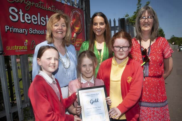 Mrs Siobhan Gillen, Principal, Miss Bronagh Lynch, teacher and Mrs Sarah Brown, Classroom Assistant pictured with members of the Eco Committee,: Farrah, Elsa and Maya after receiving the Sustrans Gold School Mark on Wednesday morning.