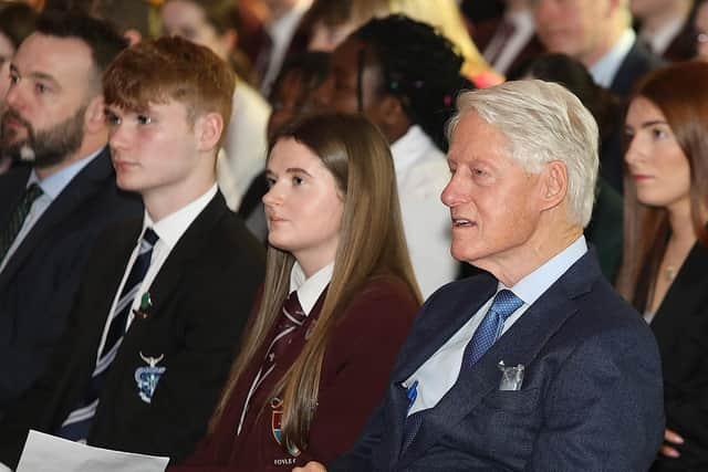 James Tourish from St. Columb’s College and Ellianna McBride from Foyle College with Bill Clinton.