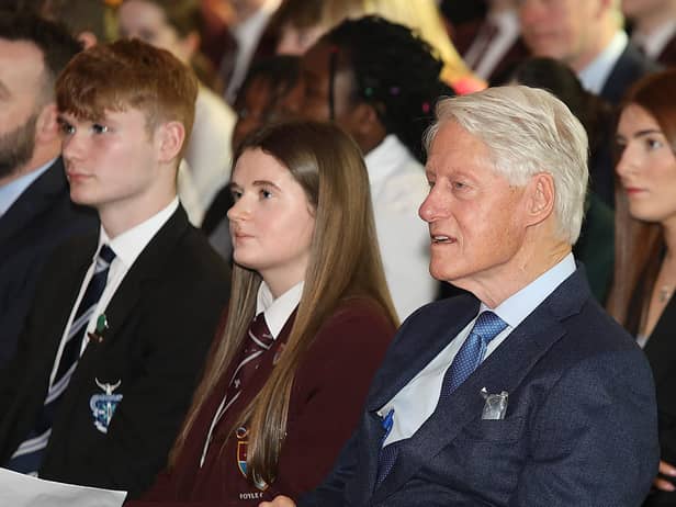 James Tourish from St. Columb’s College and Ellianna McBride from Foyle College with Bill Clinton.