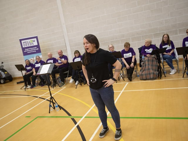 Mairead Nic Bhloscaidh, City of Derry International Choral Festival praises the Mellow Deeds Choir after their performance in Creggan on Friday morning.