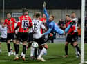 Dundalk goalkeeper Nathan Shepperd desperately claws away this effort in the second half as the visiting defence were under siege. Photo by Kevin Moore.