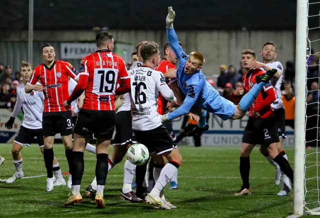 Dundalk goalkeeper Nathan Shepperd desperately claws away this effort in the second half as the visiting defence were under siege. Photo by Kevin Moore.