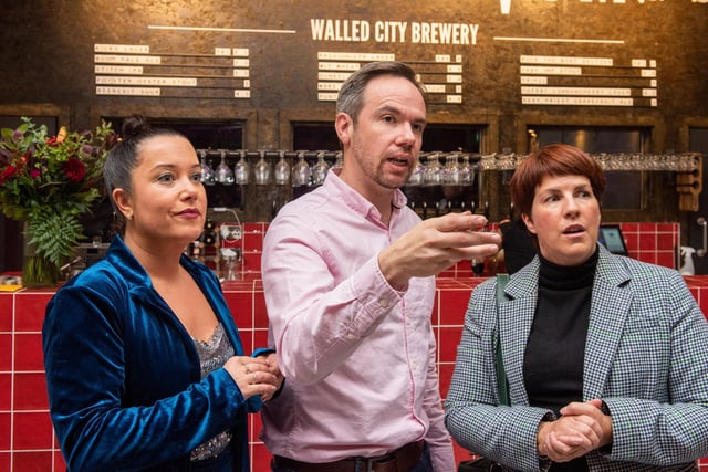 James and Louise Huey and Jennifer McKeever, Airporter, pictured at the opening of The Taproom at the Walled City Brewery. Picture Martin McKeown. 21.10.22