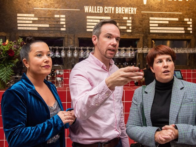 James and Louise Huey and Jennifer McKeever, Airporter, pictured at the opening of The Taproom at the Walled City Brewery. Picture Martin McKeown. 21.10.22