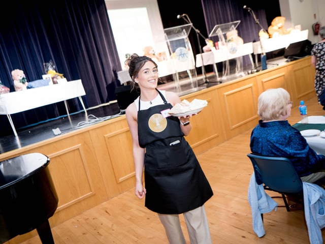 Working hard and providing plenty of sandwiches.