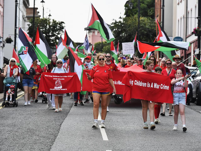 The ‘Turn Shipquay Street Red for Gaza’ march makes its way along Bishop Street  towards Shipquay Street on Saturday afternoon. Photo: George Sweeney