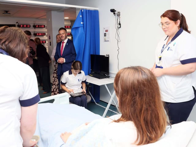 Health Minister Robbie Butler MLA observes students within the Simulated Interprofessional Learning Centre designed to replicate clinical experiences helping students develop the confidence, competence and professional judgement required to deliver safe, compassionate care.