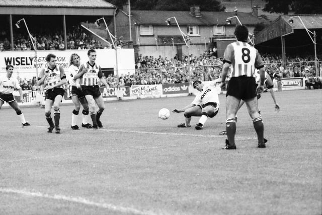 Kevin Brady, Paul Curran and Felix Healy look on as Gary Mabbutt takes a tumble.