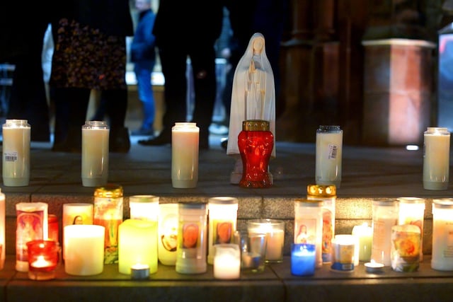 Candles placed on the steps of the Guildhall beside a statue of the Blessed Virgin Mary at a vigil held on Monday evening to remember those who died in the Creeslough tragedy on Friday afternoon last.  Photo: George Sweeney.  DER2241GS – 60