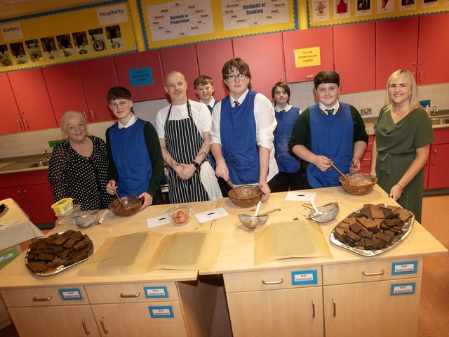 Staff and students hard at work in the Home Economics Department at St. Joseph's on Thursday night last.