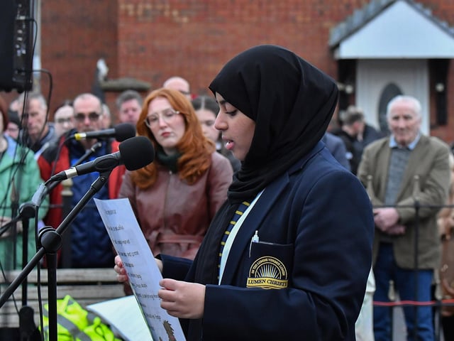 A pupil from Lumen Christi College reads a poem at the one minute silence dedicated to the children of Gaza at the Bloody Sunday monument on Thursday afternoon. Photo: George Sweeney