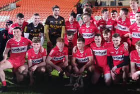 Derry celebrate their McKenna Cup victory in the Armagh Athletic Grounds.