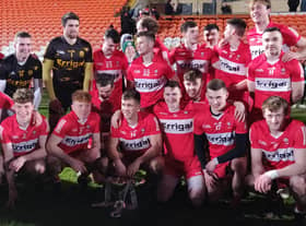 Derry celebrate their McKenna Cup victory in the Armagh Athletic Grounds.