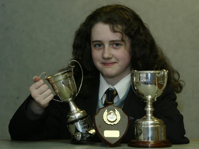 Rebecca O'Doherty of the McGinley School of Music, winner of the Jane McCauley Cup or 10 - 12 yrs girls Vocal, the Helen Keaveney Cup for 10 - 12 Piano solo and the Interpretation under 12and violin 10 - 12 at Moville Feis. (0705JB40):Winners at the Moville Feis in 2004.:Moville Feis 2004