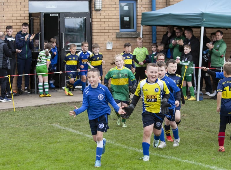 Young players make their way out for the finals to the sounds of the Champions League music at St. Joseph’s on Sunday.