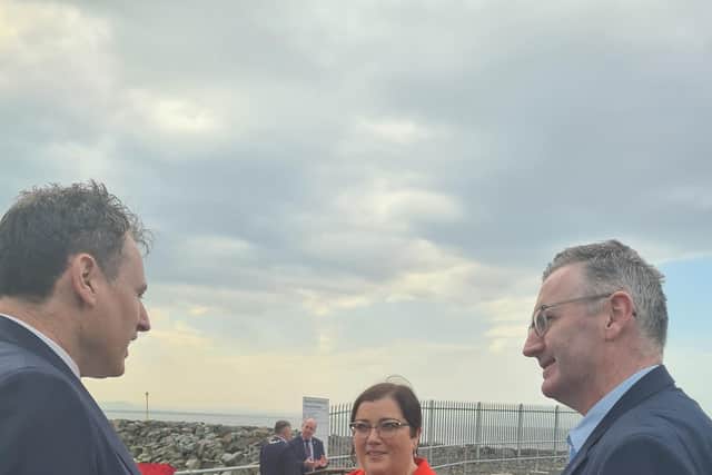 The Minister for Agriculture, Food and the Marine, Charlie McConalogue, cuts the ribbon at the official opening of the Greencastle Harbour Breakwater.