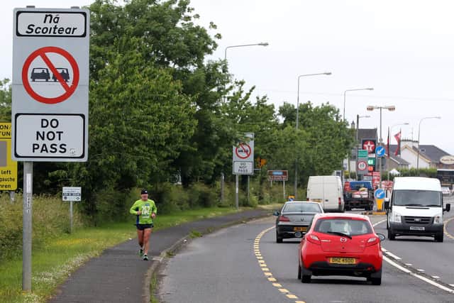 Cars cross the controless border between Northern Ireland and Ireland at the Muff border between Derry and Donegal. (PAUL FAITH/AFP via Getty Images)