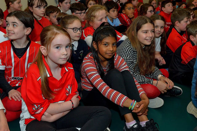 Pupils from Good Shepherd Primary School gave a rapturous welcome to Derry City players Mark Connolly, Liam Mullan and Jack Lemoignan during a visit to the school, with the FAI Cup, on Friday afternoon. Photo: George Sweeney. DER2247GS – 86