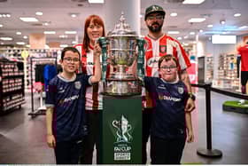 Derry City supporters, from left, Lucas, age 9, Denise, Dave, and Rhys Brown, age 7, with the Sports Direct Men’s FAI Cup Trophy. Photo by Ben McShane/Sportsfile