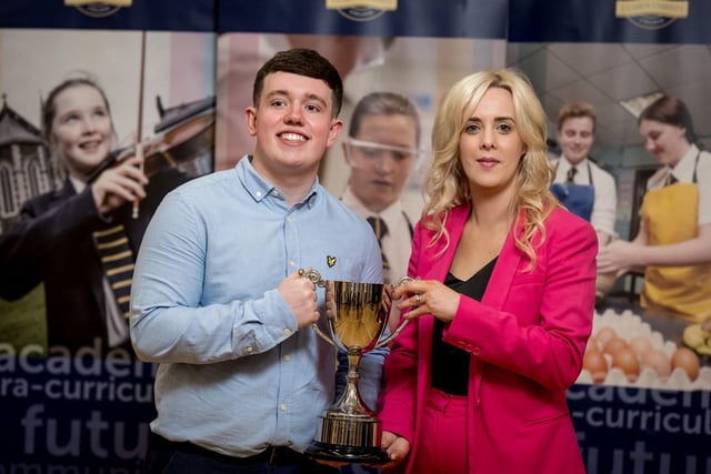 Mrs Léan McShane (Senior Teacher) presenting the Business Eye Award to Cian Martin.