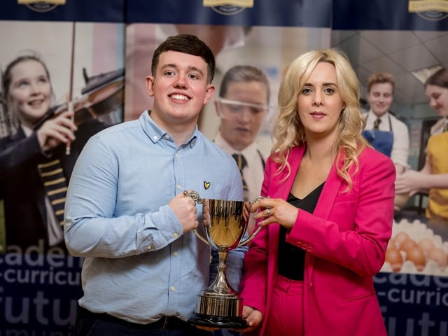 Mrs Léan McShane (Senior Teacher) presenting the Business Eye Award to Cian Martin.