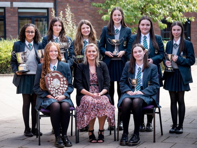 Top Performing Student in Each Subject. Front Row: Sarah Hunter, Ms C. Barr (Head of Year), Ava Roddy. Back Row: Maria Mehany, Erin Fox, Holly Hutcheon, Katy Creagh, Megan Kelly, Eva McConnell.