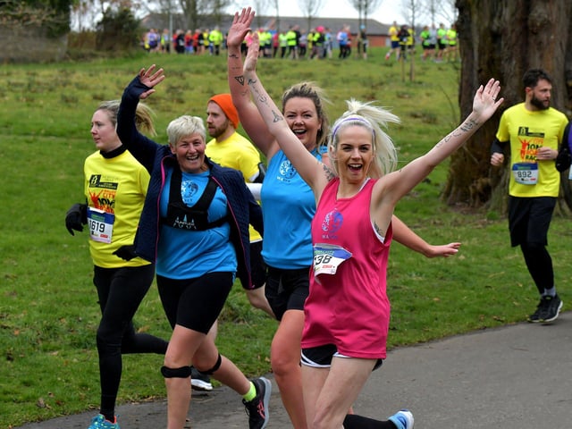 Happy runners despite the bitter cold during the Bentley Group Derry 10 Miler road race on Saturday morning. Photo: George Sweeney. DER2310GS – 103