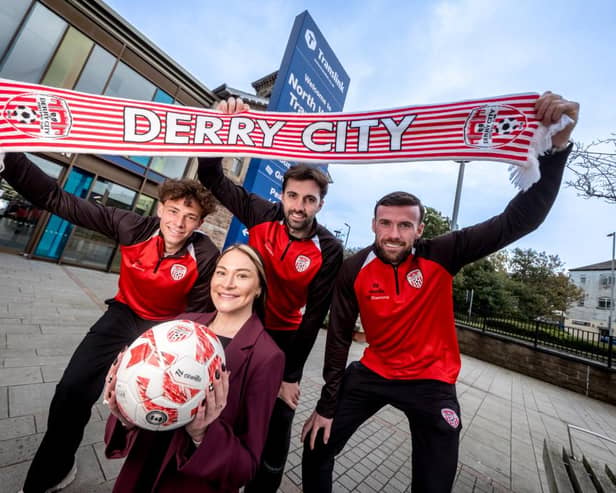 Hannah Rooney, Translink Assistant Route Manager for Northern Area Rail, pictured at the North West Transport Hub with Derry City FC players Nick Twisk, Ellis Chapman and Patrick McClean.