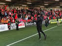 Derry City manager Ruaidhri Higgins salutes fans at Brandywell.