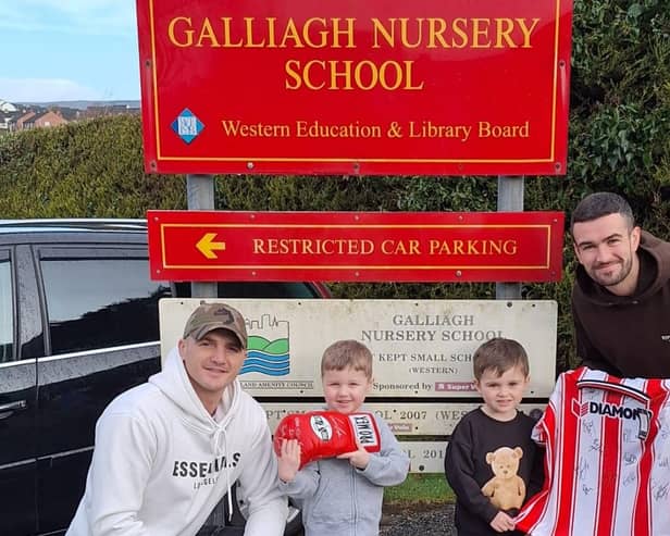 Conor Coyle and Michael Duffy with their children who attend Galliagh Nursery School
