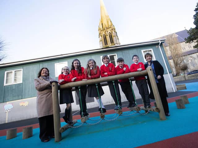 Mayor, Patricia Logue and Dana pictured with a group of Primary 6 children at one of the new play structures at St. Eugene's PS.