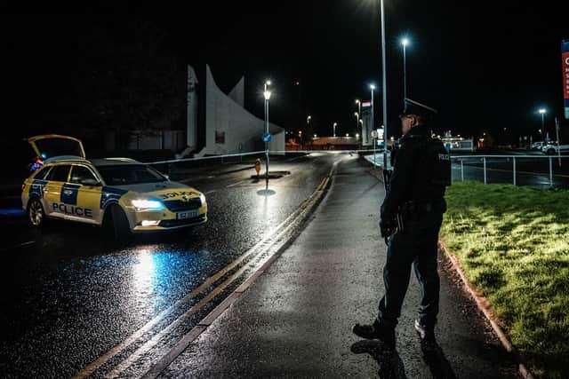 A police officer at the scene in the Waterside on Sunday night. Photograph: Aodhán Roberts